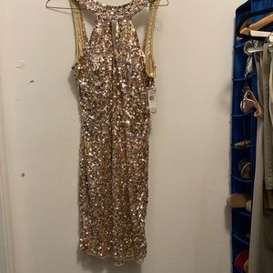 Beautiful, gold sequenced woman’s dress